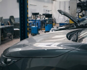 An empty auto dealer service bay area illustrates the serious technician shortage.