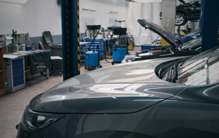 An empty auto dealer service bay area illustrates the serious technician shortage.