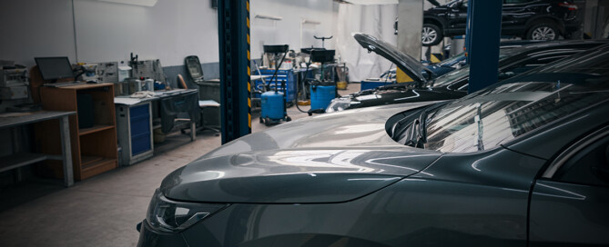 An empty auto dealer service bay area illustrates the serious technician shortage.