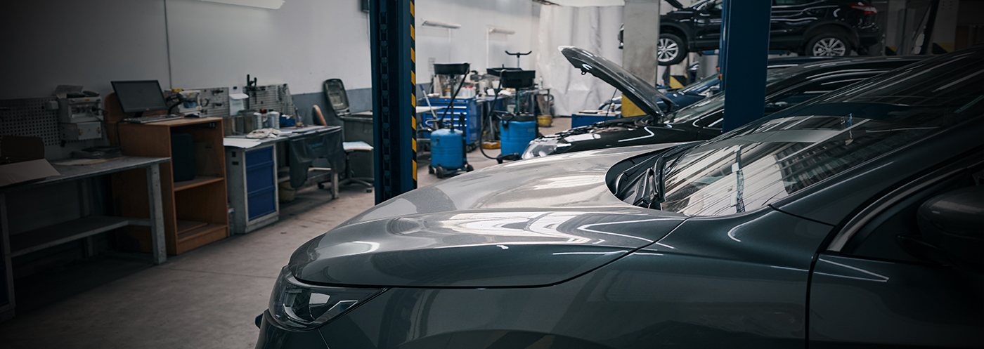 An empty auto dealer service bay area illustrates the serious technician shortage.